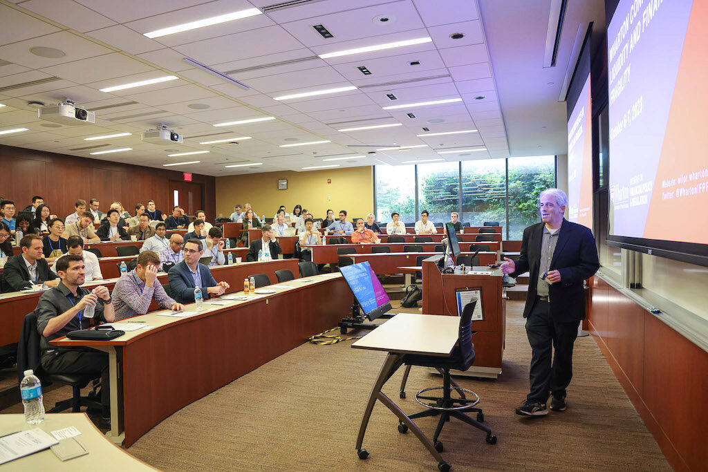 Professor Itay Goldstein introduces the conference in a lecture hall