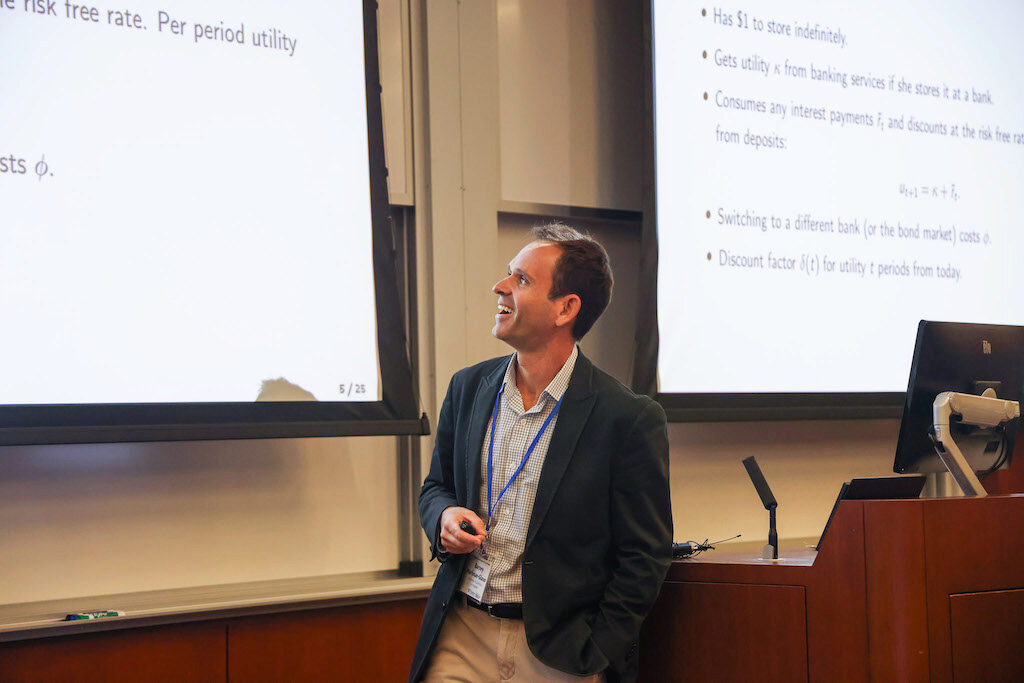 Barney Hartman-Glaser smiles while giving a lecture