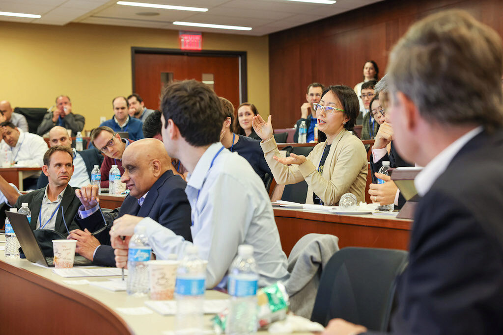 An engaged audience discusses a recent lecture