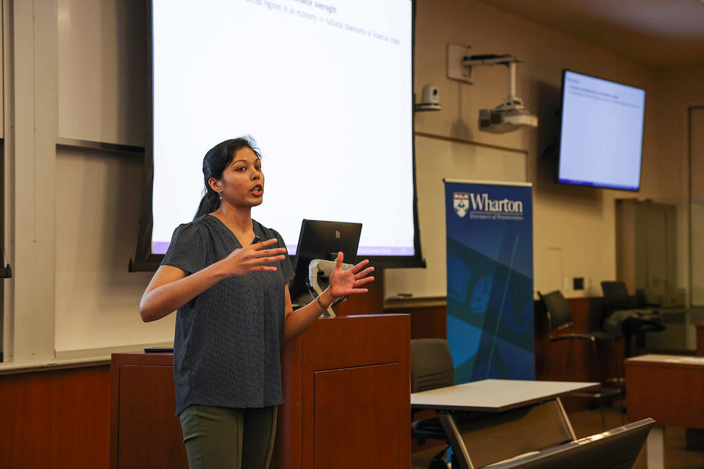 A lecturer addresses the audience
