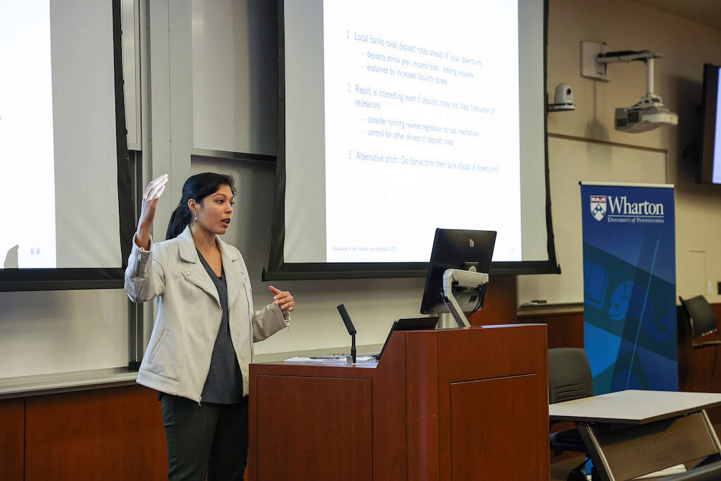 A lecturer addresses the audience