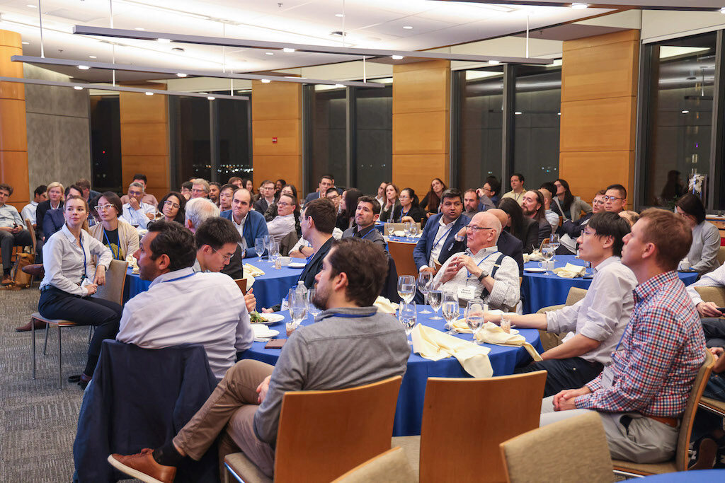 A captivated audience watches a lecture.
