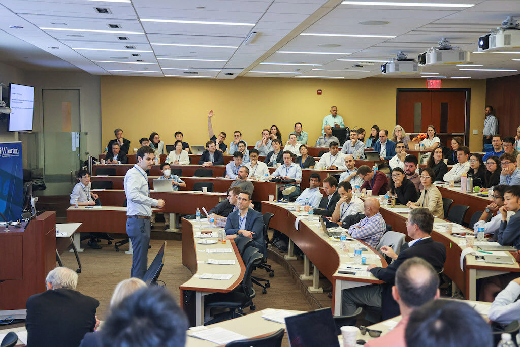 Matthew Baron addresses an audience in a lecture hall