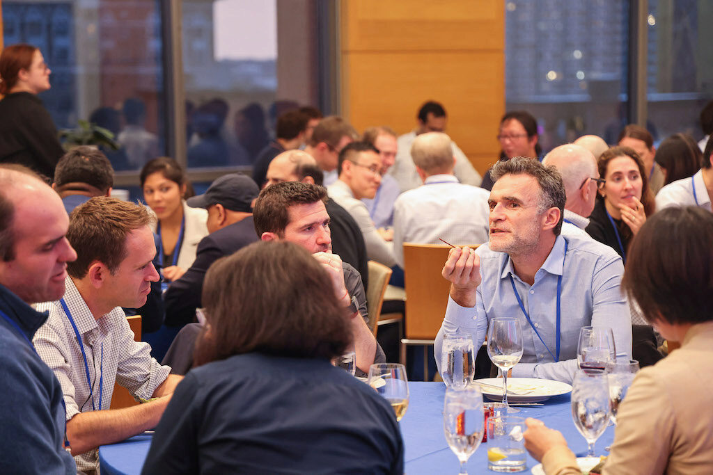 Conference attendees having lunch and talking