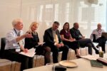 The Rethinking Optimal Deposit Insurance panel in conversation in a classroom.