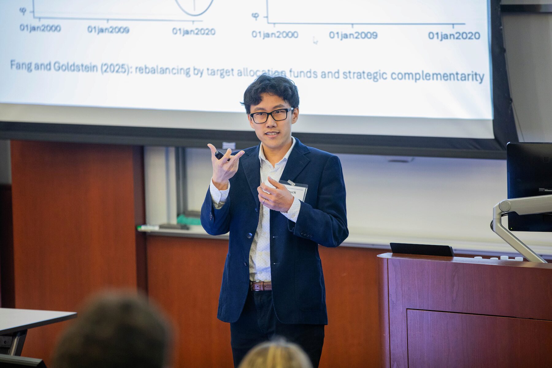 A conference speaker addresses an audience