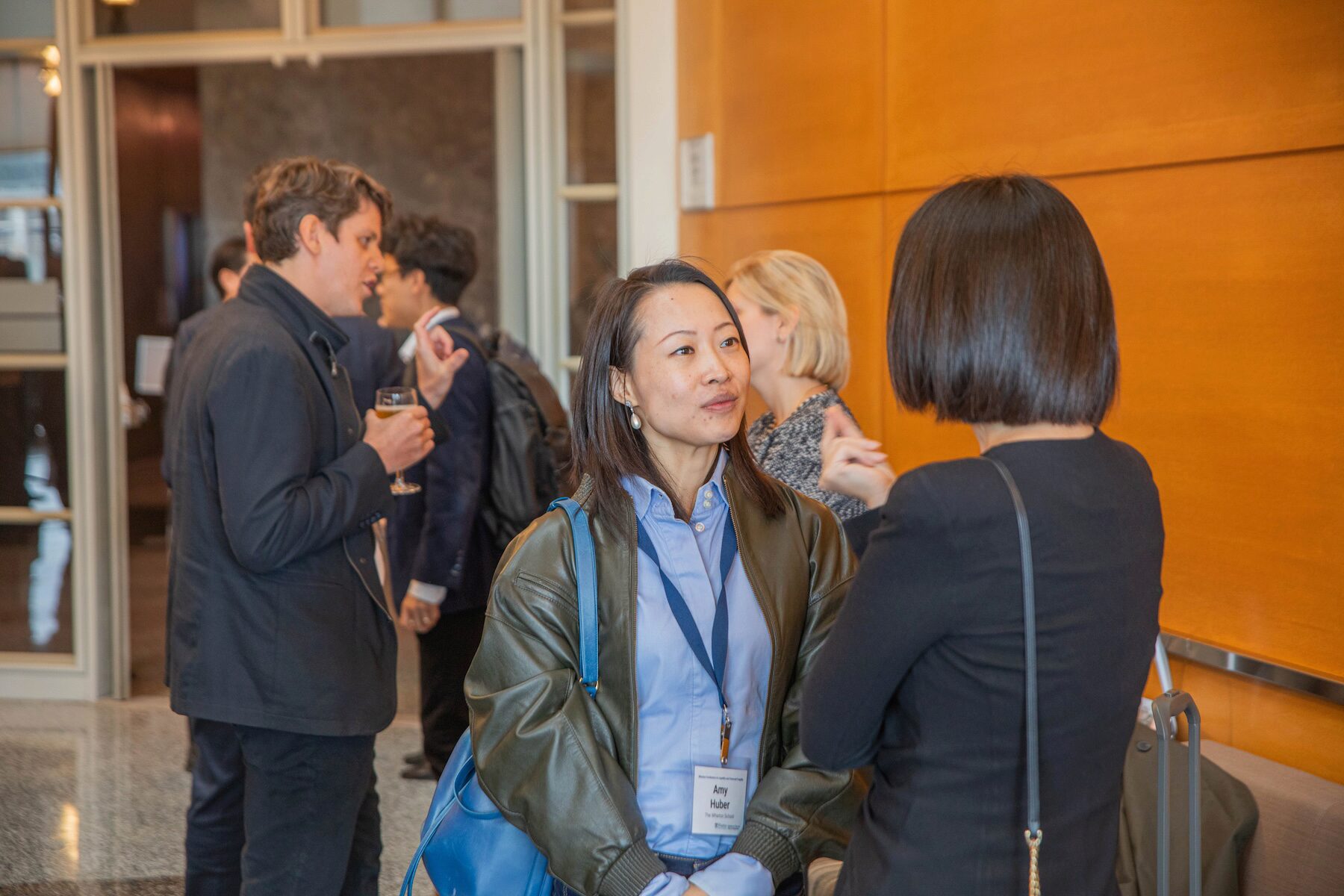 Conference participants mingling at a reception